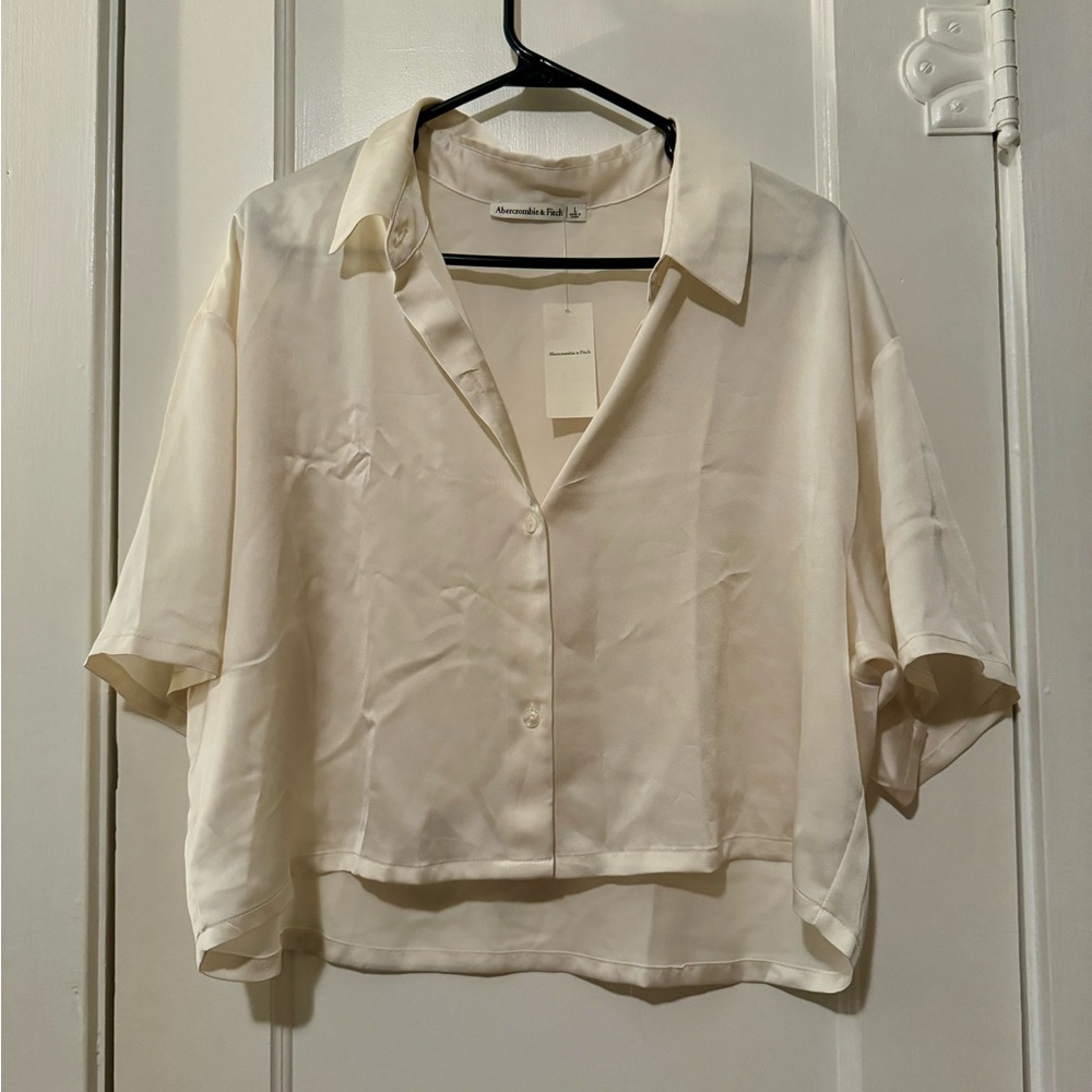 Abercrombie’s women’s large boxey satin button up shirt cream